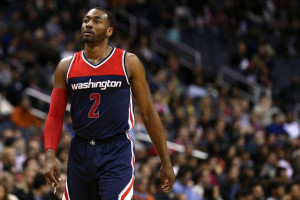 WASHINGTON, DC - JANUARY 03: John Wall #2 of the Washington Wizards looks on against the Miami Heat during the first half at Verizon Center on January 3, 2016 in Washington, DC. NOTE TO USER: User expressly acknowledges and agrees that, by downloading and or using this photograph, User is consenting to the terms and conditions of the Getty Images License Agreement. Patrick Smith/Getty Images/AFP