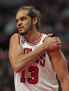 Joakim Noah #13 of the Chicago Bulls grabs his shoulder after hitting the floor hard against the Washington Wizards at the United Center on January 11, 2016 in Chicago, Illinois. The Wizards defeated the Bulls 114-100. NOTE TO USER: User expressly acknowledges and agrees that, by downloading and or using the photograph, User is consenting to the terms and conditions of the Getty Images License Agreement. Jonathan Daniel/Getty Images/AFP