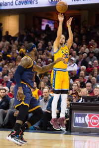 Stephen Curry #30 of the Golden State Warriors shoots over LeBron James #23 of the Cleveland Cavaliers during the first half at Quicken Loans Arena on January 18, 2016 in Cleveland, Ohio. NOTE TO USER: User expressly acknowledges and agrees that, by downloading and/or using this photograph, user is consenting to the terms and conditions of the Getty Images License Agreement. Mandatory copyright notice. Jason Miller/Getty Images/AFP