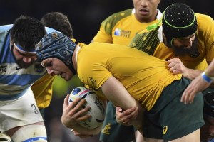 Australia's number 8 David Pocock runs with the ball during a semi-final match of the 2015 Rugby World Cup. (AFP)
