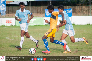 Sunthararaj Niresh going past two St.Joseph's defenders in midfield.
