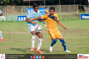 St.Peter's striker Peshala Rajakaruna (R) a Josephian (L) defender tussling for the ball.
