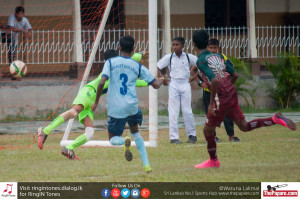 Mohamed Shafir of Zahira College scores past Wesley goalkeeper Mohamed Nifraz.