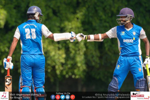 Minod and Dimuth Karunaratne congratulating each other after a fifty run stand