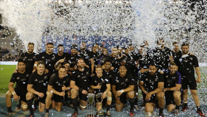 The All Blacks celebrate with The Rugby Championship trophy in Buenos Aires.