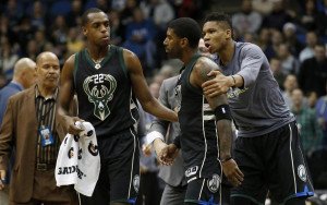 Milwaukee Bucks forward Giannis Antetokounmpo, right, and guard Khris Middleton, left, restrain guard O.J. Mayo, center, as he goes toward a referee after being assessed a second technical foul during the first half of an NBA basketball game against the Minnesota Timberwolves in Minneapolis, Saturday, Jan. 2, 2016. (AP Photo/Ann Heisenfelt) ORG XMIT: MNAH101