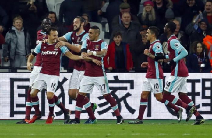 West Ham United's Mark Noble celebrates scoring their first goal with team mates