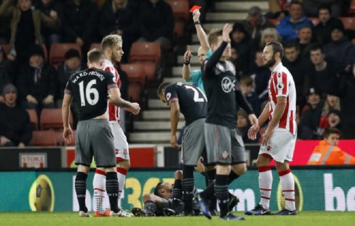 Referee Anthony Taylor sends off Stoke City's Marko Arnautovic after a second yellow card